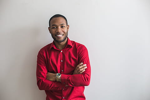 A man wearing the red colored mens shirts
