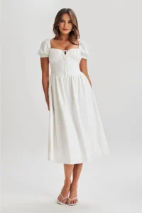 woman wearing white midi dress, showing it's unbeatable charm